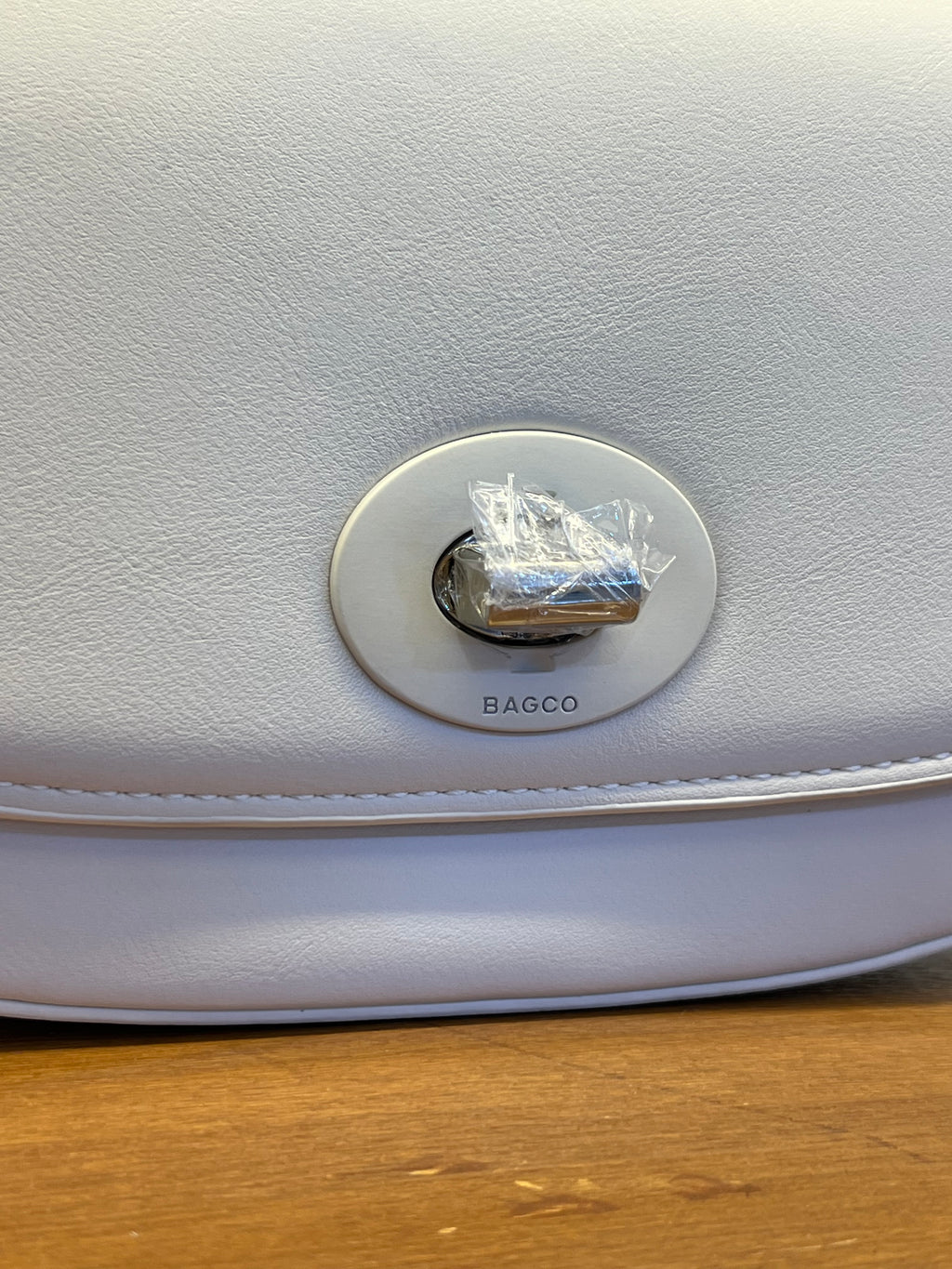 Elegant Ivory Shoulder Bag with Flap Closure