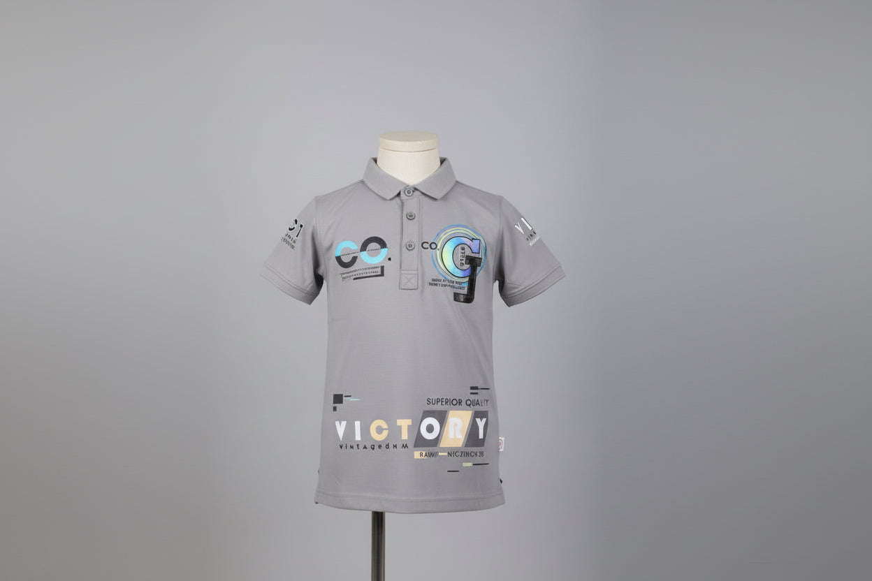 Gray polo shirt with branding and text on a tiled floor background